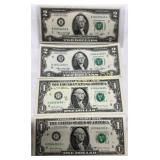 Four U.S. Banknotes: Two $2 Bills and Two $1 Bills