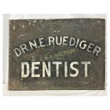 Early Dr. N.E. Ruediger Dentist Tin Sign, 22in x 1