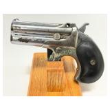 Double-Barrel Derringer-Style Pistol with Metal Fr