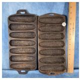 TWO CAST IRON CORN BREAD PANS