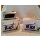 2 Brookstone Self Setting Clocks