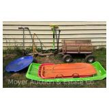 Group of Scooters, Wagon, Pogo Sticks, and Sleds