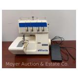 White Superlock 734D Serger, with Accessories