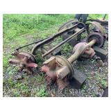Group of Scrap Behind Barn, Wheels, Axles, Etc.