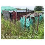 Large Group of Firewood in Field