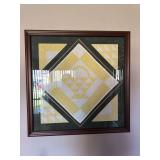 Framed quilt pieces