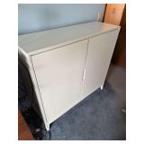 White storage cabinet. Chip in corner