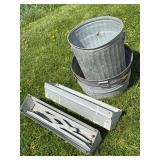 Metal saw horses and trash cans