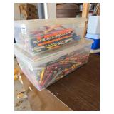 2 tubs of crayons and pencils
