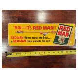 Red Man Tobacco advertising sign with bold printed graphics. Tobacco-related advertising collectible suitable for display in a collection, shop, bar, or man cave.