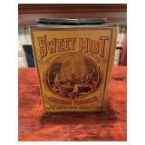 Sweet Mist chewing tobacco tin with printed advertising graphics. Rectangular tin measures approximately 11 in. x 8 in. Decorative vintage advertising collectible with age-related wear.