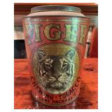 Tiger chewing tobacco tin with printed advertising graphics. Decorative vintage advertising collectible with age-related wear and display appeal.