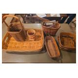 Five Longaberger baskets as shown. Assorted basket group with woven wood construction and traditional Longaberger styling, suitable for collecting, display, storage, gift baskets, or resale.