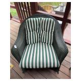 Wicker-style patio furniture set with sofa, two chairs, and matching table. Material composition has not been determined. Outdoor-style seating group with woven-look construction suitable for porch, p