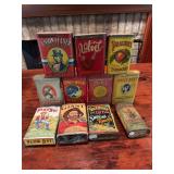 Nine vintage tobacco-related tins and two packs as shown. Includes assorted tobacco advertising tins, pocket tins, and related packaging with printed graphics and age-related wear.