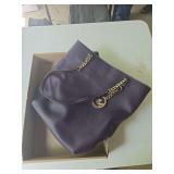 Michael Kors purse as shown. Appears to be a Michael Kors handbag, but has not been professionally authenticated and authenticity is not guaranteed. Selling as-is. Suitable for use, collection, or res
