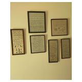 Six modern needlepoint-style wall décor reproductions with assorted decorative designs. Framed pieces with traditional, vintage-inspired styling suitable for grouped wall display, hallway, bedroom, o