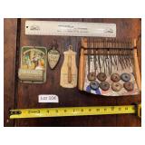 Advertising items and thumb piano as shown. Assorted group includes small advertising display pieces and a handheld thumb piano / kalimba. Decorative collectible grouping suitable for advertising, mus