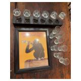 Liquor-themed print, novelty monkey figure, and shot glasses as shown. Assorted barware and decorative group with playful display appeal, suitable for home bar, game room, man cave, liquor advertising