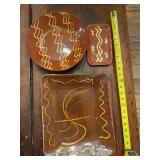 Three pieces of red stoneware pottery as shown. Assorted decorative stoneware pieces with red glaze finish and traditional pottery styling, suitable for kitchen, shelf display, country décor, or coll