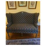 Grand Northampton-style sofa with rolled arms, exposed wood accents, and traditional upholstery. Features a formal living room design with decorative fabric and classic styling.