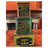 Three vintage tobacco tins as shown. Includes assorted advertising tins with printed graphics and age-related wear. Decorative collectible group suitable for display.