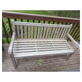 Wood bench and matching table with simple outdoor-style construction. Suitable for porch, patio, garden, or casual outdoor seating area.