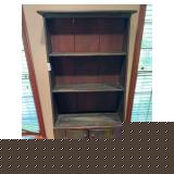 Vintage pine cabinet with distressed green painted patina and paneled doors. Features rustic country styling with visible wear and age consistent with use. Attractive decorative storage piece with pri