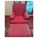 Arm chair with matching ottoman. Upholstered chair features rolled arms and traditional styling. Ottoman shows fading, and both pieces could use cleaning. Suitable for living room, bedroom, sitting ar