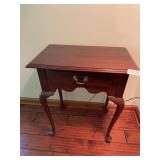 Ethan Allen wooden side table with single drawer and lower shelf. Traditional furniture piece suitable for living room, bedroom, or accent use. Shows wear consistent with age and normal household use.
