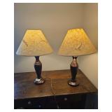 Pair of wooden table lamps with traditional styling. Suitable for use on side tables, nightstands, console tables, or accent furniture.