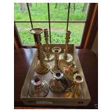 Flat of mostly brass candle holders as shown. Assorted grouping includes brass and brass-style candlesticks and related decorative pieces in various sizes and styles. Suitable for tabletop display, ma
