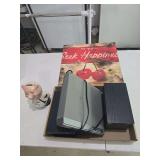 DVD player, piggy bank, speakers and small wall art