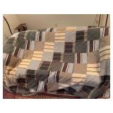 Taylor Linens quilt with patterned fabric design. Measures approximately 93 in. x 88 in. Quality bedding piece suitable for bedroom use, guest room, display, or resale.