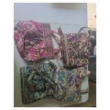 Four Vera Bradley handbags as shown. Assorted patterned fabric bags in various styles and sizes. Suitable for use, travel, storage, collection, or resale.