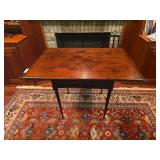Antique wooden table with rectangular top and turned legs. Features traditional early furniture styling with aged patina and wear consistent with age and use. Suitable as an accent, side, or primitive