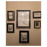 Six framed wall art pieces including architectural, cityscape, European street scene, and farmhouse prints, plus one framed botanical-style dried flower display. Includes identified subjects such as C