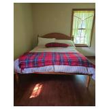 Queen-size bed frame with memory foam mattress. Features a traditional wood headboard and footboard with turned post styling. Includes bed frame components and mattress. Located on second floor; buyer