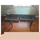 Antique wooden desk with traditional styling and multiple drawers. Features a writing surface with drawer storage and an aged finish consistent with use. Suitable for office, study, or decorative use.