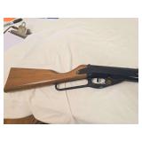 Daisy Model 95 lever-action BB gun with wood stock and forearm and black metal receiver. Shows general age-related wear as shown.