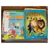 Large group of mostly vintage children’s books including Little Golden Books, McGuffey readers and other classics. Visible titles include The Wizard of Oz and Tom and Jerry’s Photo Finish among ot