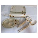 Assorted Autumn Leaf pieces including two rectangular serving trays, ceramic rolling pin, three-egg serving tray, and matching ceramic serving spoon and fork. Pieces include Hall China/China Specialti