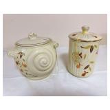 Two Hall Autumn Leaf pieces including a lidded Nautilus-style vessel with large spiral-form sides and spoon slot, and a ribbed lidded canister commemorating the National Autumn Leaf Collectors Club 30