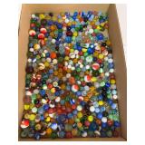 Large assortment of vintage and later glass marbles in numerous colors, patterns and sizes. Includes swirls, cat’s-eye styles, solids, clears and other varieties as shown.