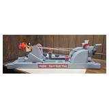 Tipton Best Gun Vise with adjustable supports, clamps and accessory storage molded into the base. Gray and red molded construction as shown.