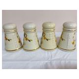 Four Hall Autumn Leaf ceramic shakers comprising Pepper, Salt, Hot Pepper and Cheese, each with cream glaze, Autumn Leaf decoration, raised lettering and gold-tone trim. Bottom markings identify later