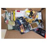 Box of mixed gun parts, slings, speed loaders and firearm accessories including scope rings, mounts, AR-15/M16-related parts and other miscellaneous components as shown.