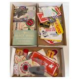 Three flats of firearm-related patches, stickers and decals featuring brands and organizations including Marlin, Federal, Springfield Armory, NRA, Remington, Black Wing Shooting Center and others as s