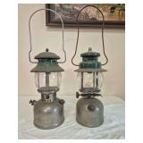 Coleman Models 202 & 242 Lanterns – Missing Parts. Vintage pressure lanterns with metal/nickel-tone founts, green ventilators and glass globes; catalog notes missing parts, with visible oxidation an