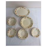 Six-piece Hall Autumn Leaf serving group including one oval platter and five assorted serving bowls with scalloped rims and gold trim. Pieces carry Hall’s Superior Quality Kitchenware markings; seve